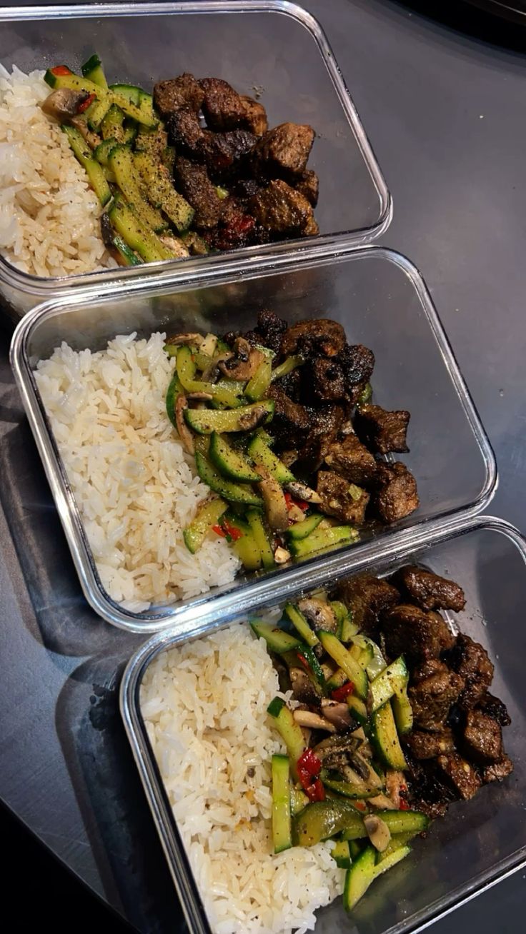 Weekly meal prep — steak, zucchini, and jasmine rice portioned into glass containers